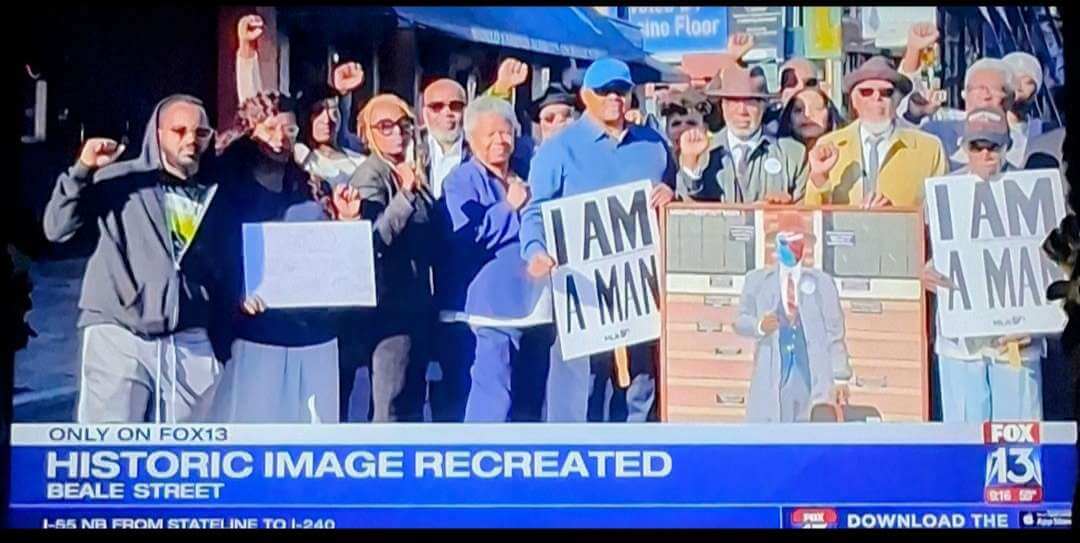 Participants of the photo shoot and reenactment of the Memphis Sanitation Workers' strike (1968) pose for group photos on Beale Street in downtown Memphis on Sunday, October 19.